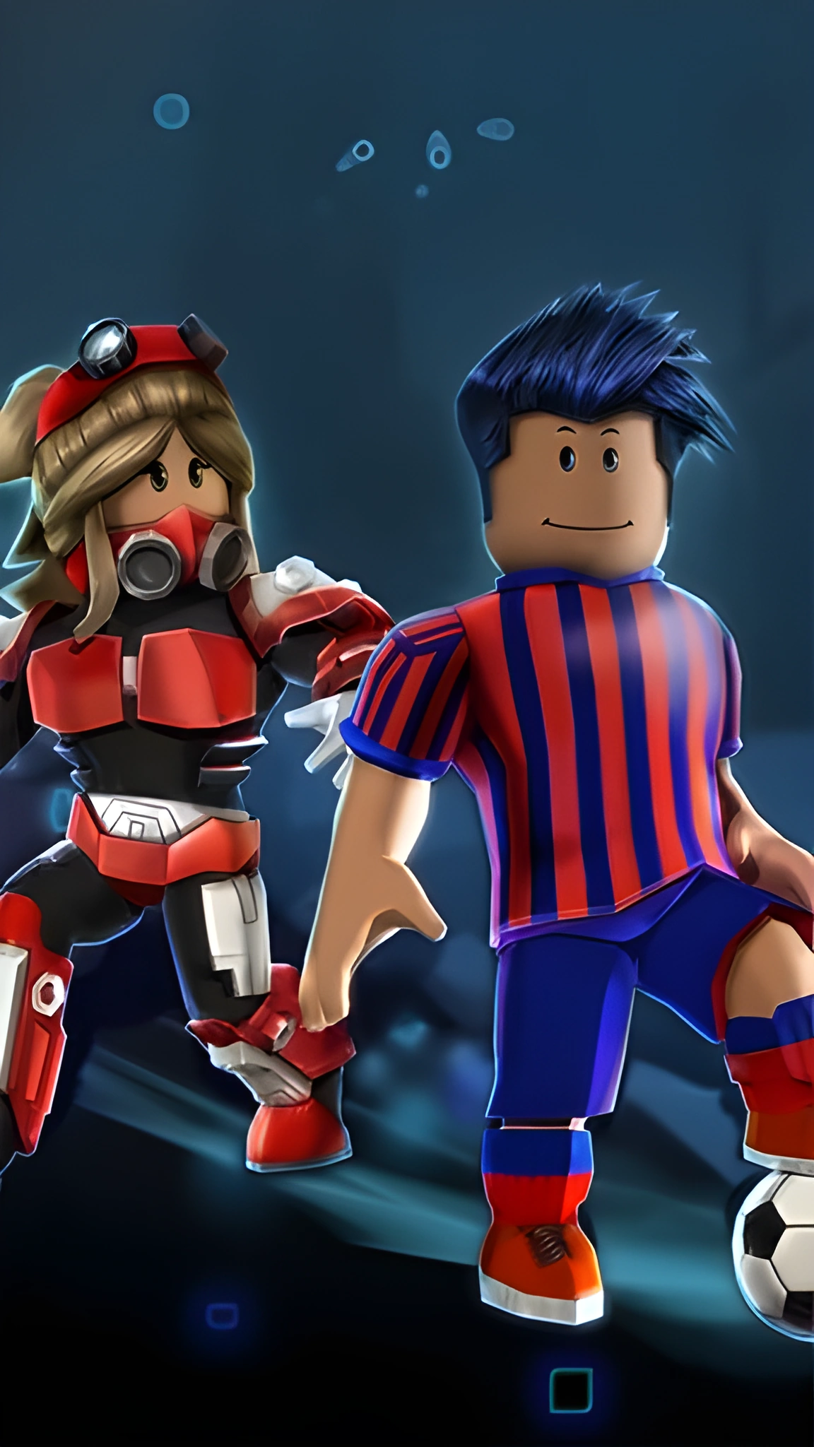 Hai nhân vật Roblox trong trang phục thể thao và bảo hộ đứng cạnh quả bóng đá trên nền xanh tối dọc cho điện thoại